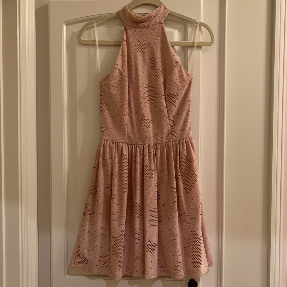 Nude high-neck, open-back dress